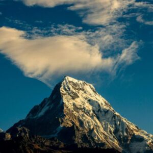 Stunning snow-capped mountain peak under a vibrant sky, perfect for nature lovers.